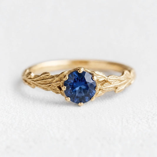 Athena’s Wisdom | Round Blue Sapphire Olive Branch Engagement Ring