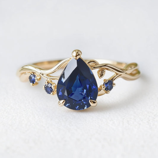 Athena’s Royalty | 1CT Pear Cut Royal Blue Sapphire Engagement Ring.
