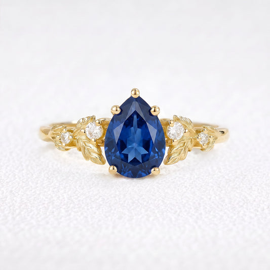 Daisy’s Twilight | 1.5CT Pear Cut Blue Sapphire Engagement Ring