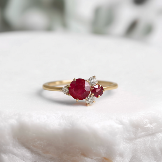 Rosalind’s Rose | Round Ruby Engagement Ring with Drifting Diamond Petal Halo