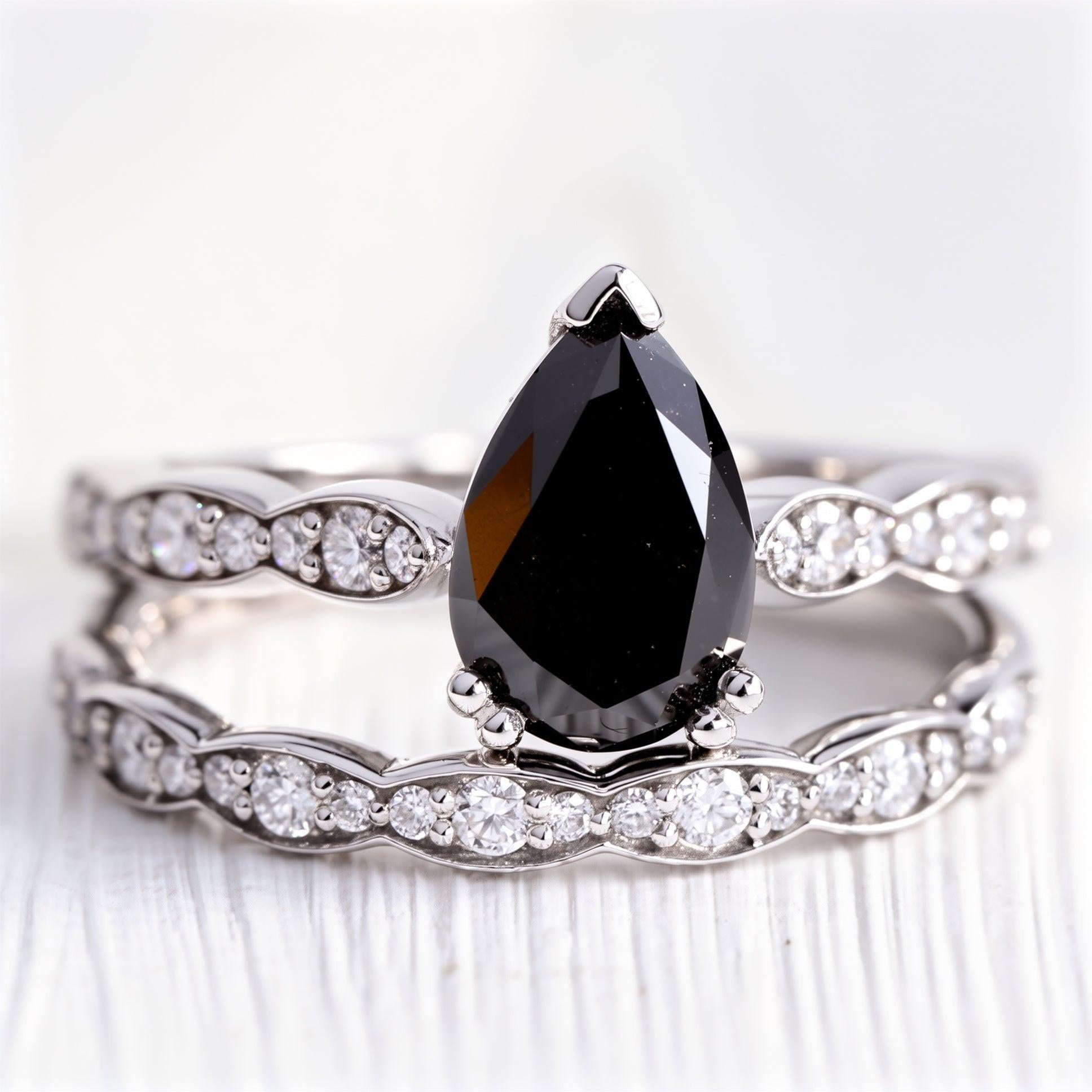 Aria‘s Cipher | Pear Cut Black Diamond Ring & Matching Diamond Band Ring Set.