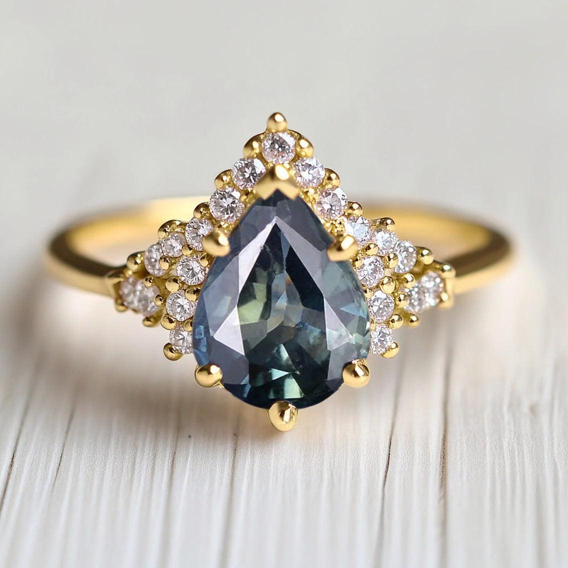 Lyra’s Twilight | Pear Blue Sapphire Partial Halo Ring.