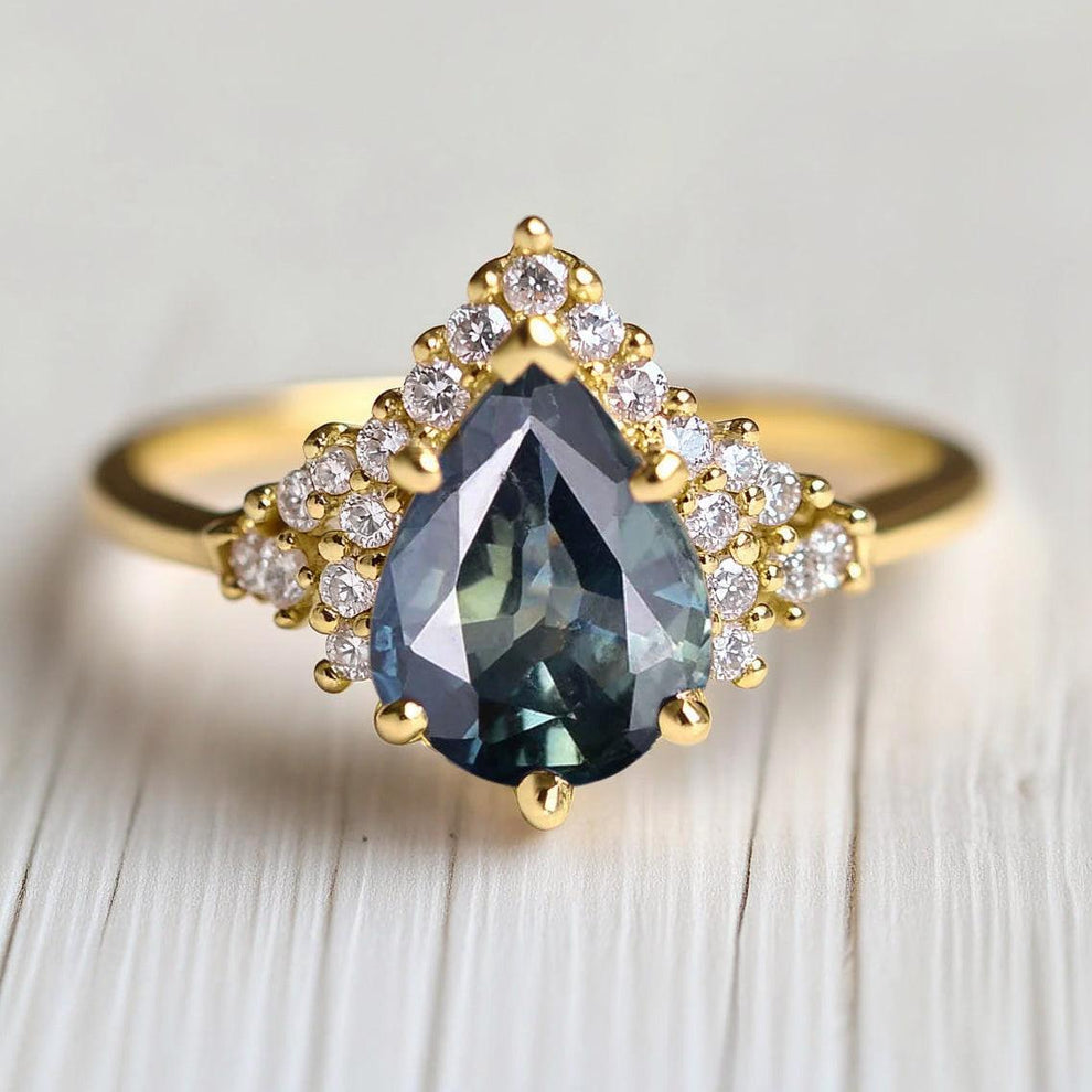Lyra’s Twilight | Pear Blue Sapphire Partial Halo Ring.