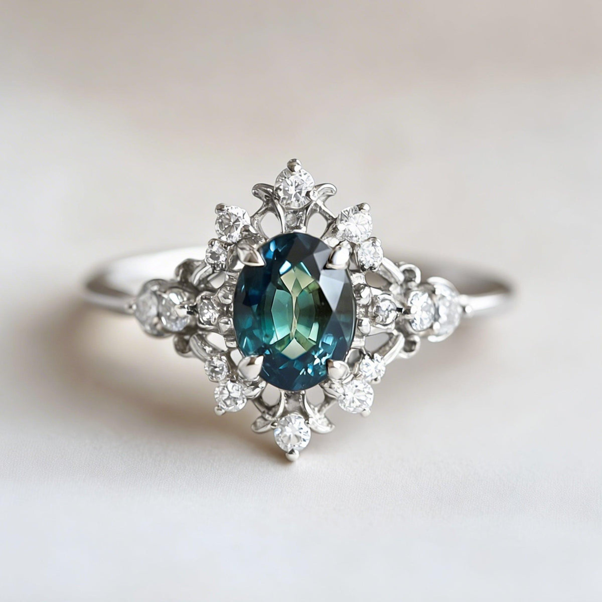 Isolde’s Crown | Teal Sapphire & Diamond Halo Engagement Ring.