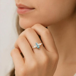 Flora’s Trinity | Minimalist Marquise Cut Moss Agate Three Stone Engagement Ring.