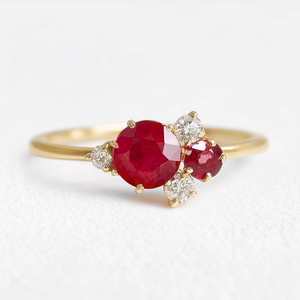 Rosalind’s Rose | Round Ruby Engagement Ring with Drifting Diamond Petal Halo.
