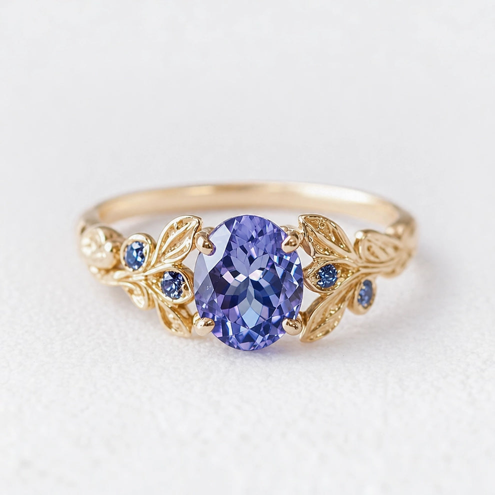 Aria‘s Glade | Oval Cut Tanzanite & Blue Diamond Leaf Engagement Ring.