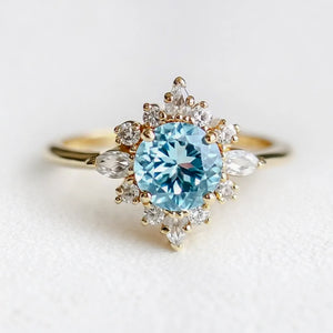Marina's Swell | Round Cut Aquamarine Halo Engagement Ring.