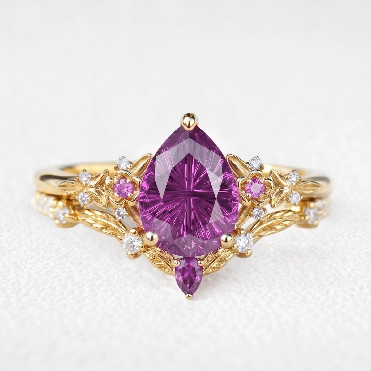 Theodora’s Diadem | Pear Fantasy-Cut Purple Sapphire Foliage Chevron Bridal Duo
