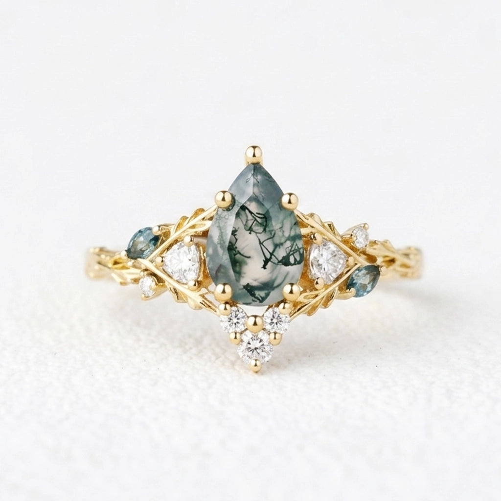 Katriel Pear Cut Lab Moss Agate Oak Leaf Engagement Ring.