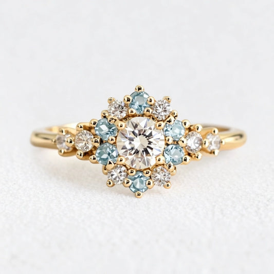 Liora's Corolla | Oval Diamond Engagement Ring with Aquamarine Petal Halo.