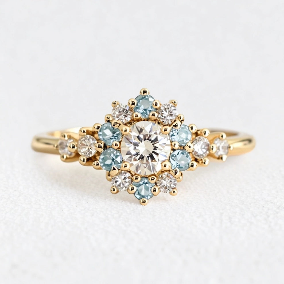 Liora's Corolla | Oval Diamond Engagement Ring with Aquamarine Petal Halo.