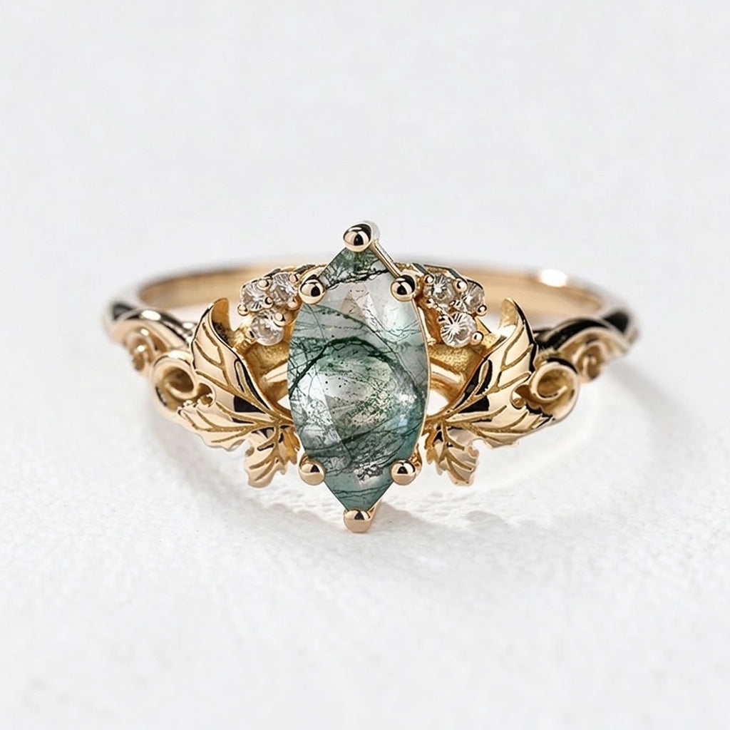 Flora’s Laurel | Marquise Cut Moss Agate Engagement Ring with Diamond Leaves.