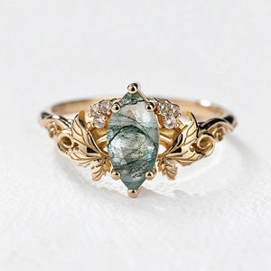 Flora’s Laurel | Marquise Cut Moss Agate Engagement Ring with Diamond Leaves.