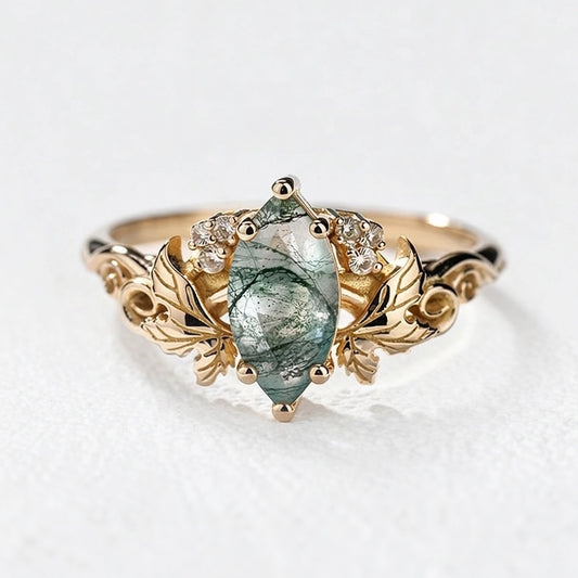 Flora’s Laurel | Marquise Cut Moss Agate Engagement Ring with Diamond Leaves.
