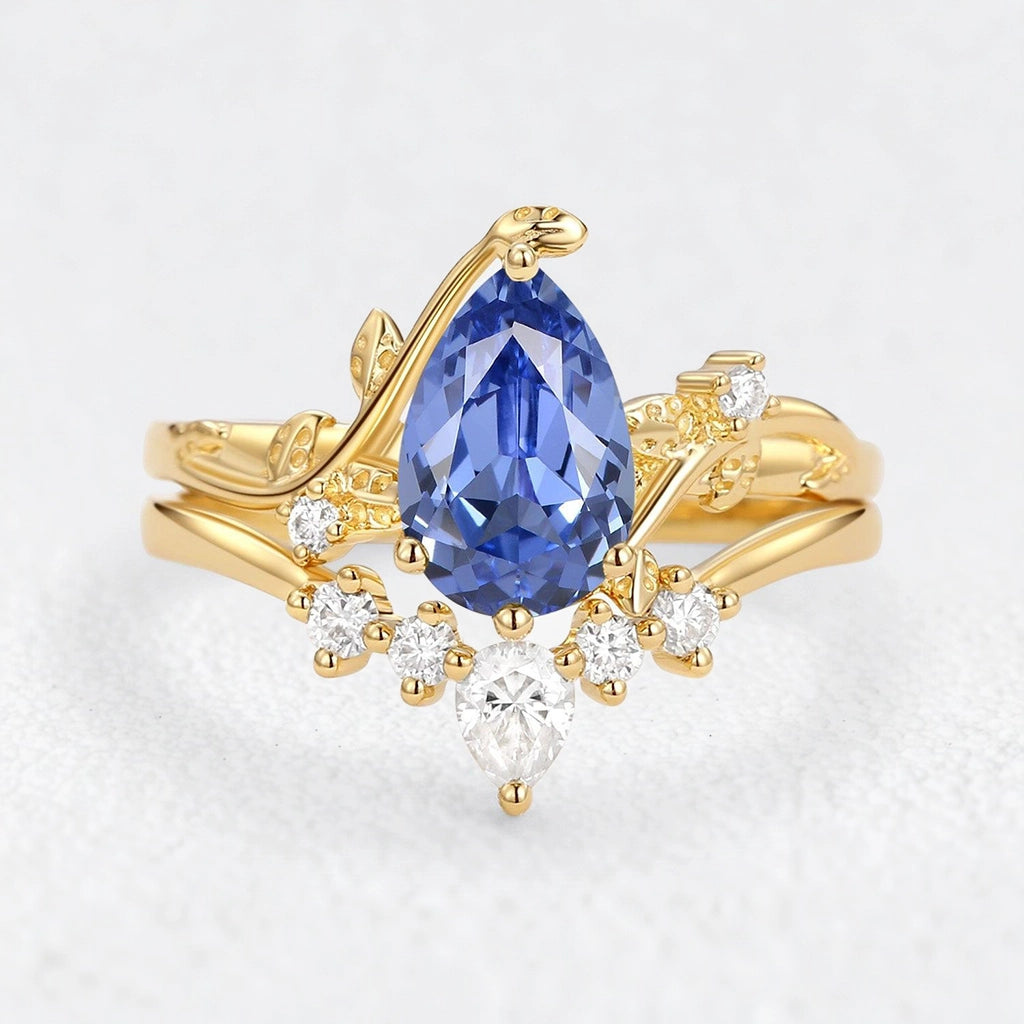 Eleonora’s Mirage | 1.5CT Pear Cut Tanzanite Foliage Bridal Duo