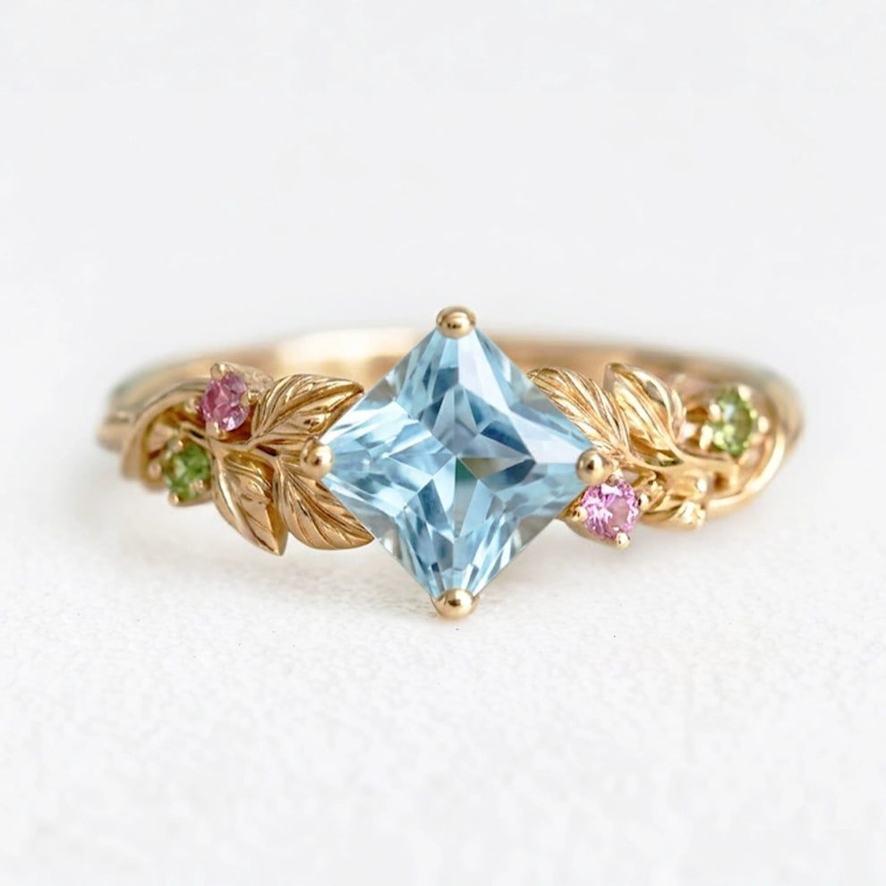 Cressida’s Stillness | Clear Blue Aquamarine Leafy Engagement Ring.