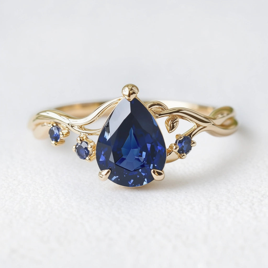 Athena’s Royalty | 1CT Pear Cut Royal Blue Sapphire Engagement Ring.