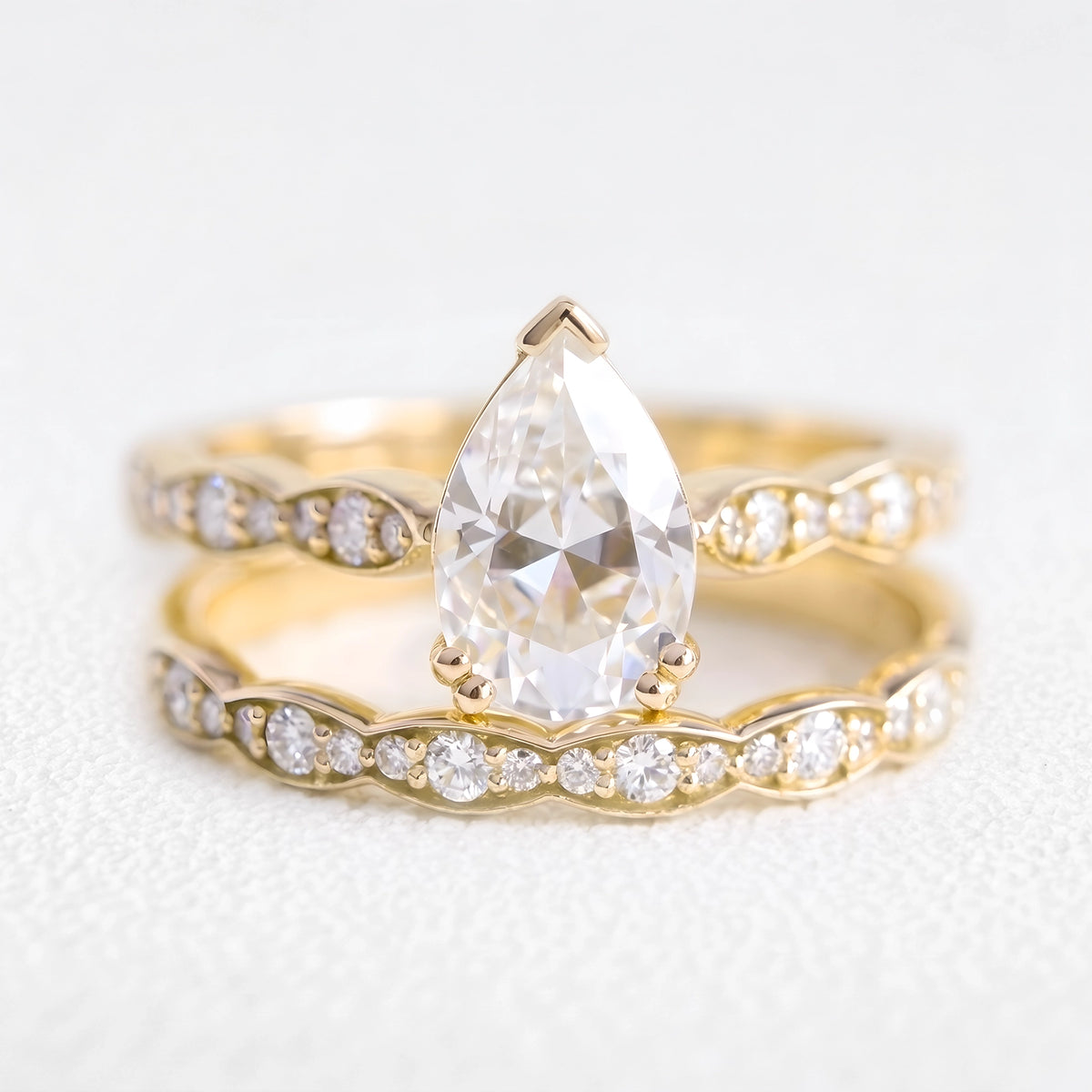 Genevieve’s Harmony | 1.5CT Pear Cut Diamond with Scalloped Pavé Bridal Duo