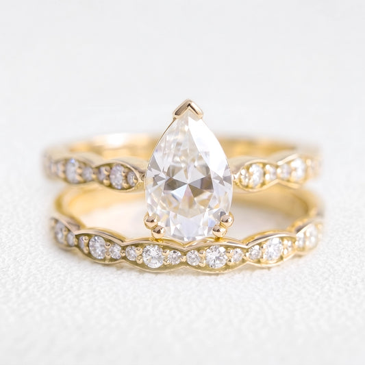 Genevieve’s Harmony | 1.5CT Pear Cut Diamond with Scalloped Pavé Bridal Duo