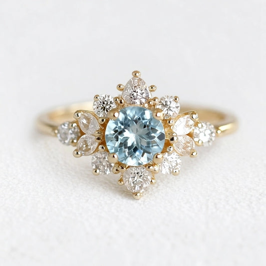 Marina's Blossom | Round Cut Aquamarine Engagement Ring With Pear Moissanite Petals.