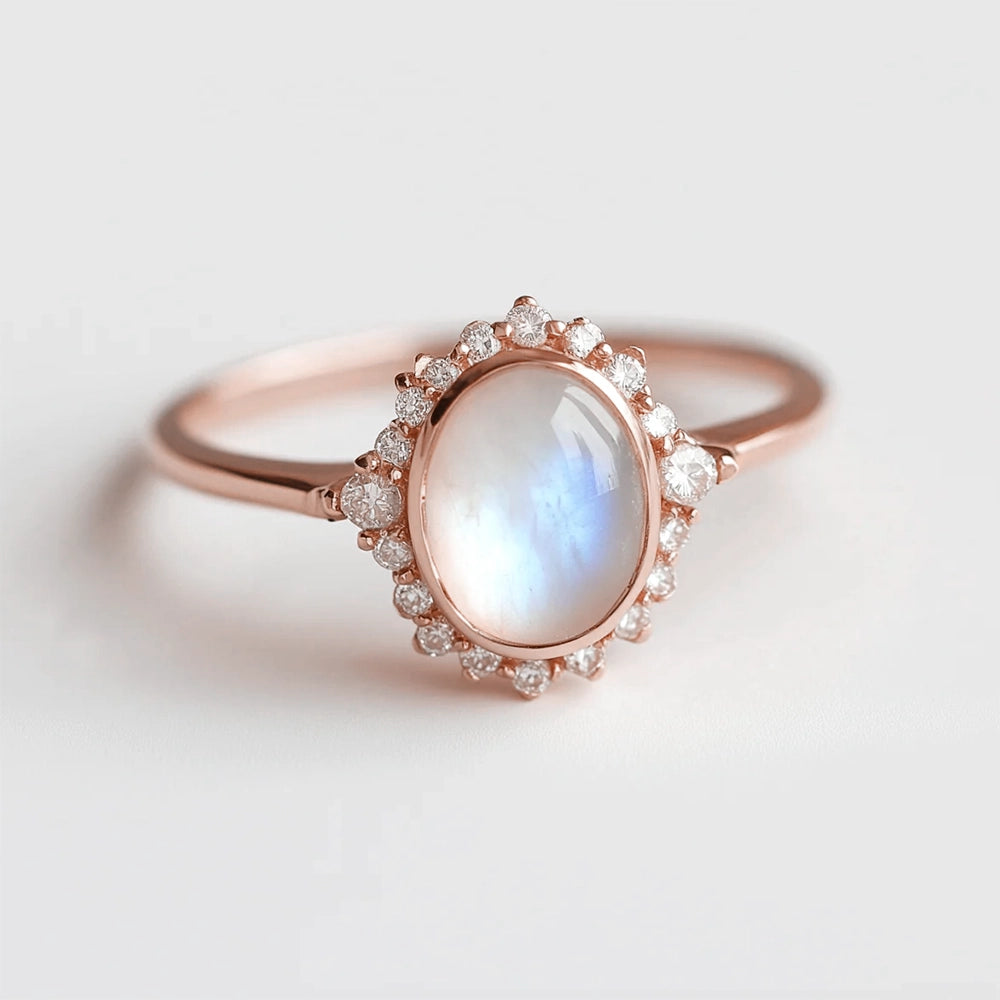 Elara’s Luster | Classic Oval Moonstone Halo Engagement Ring.