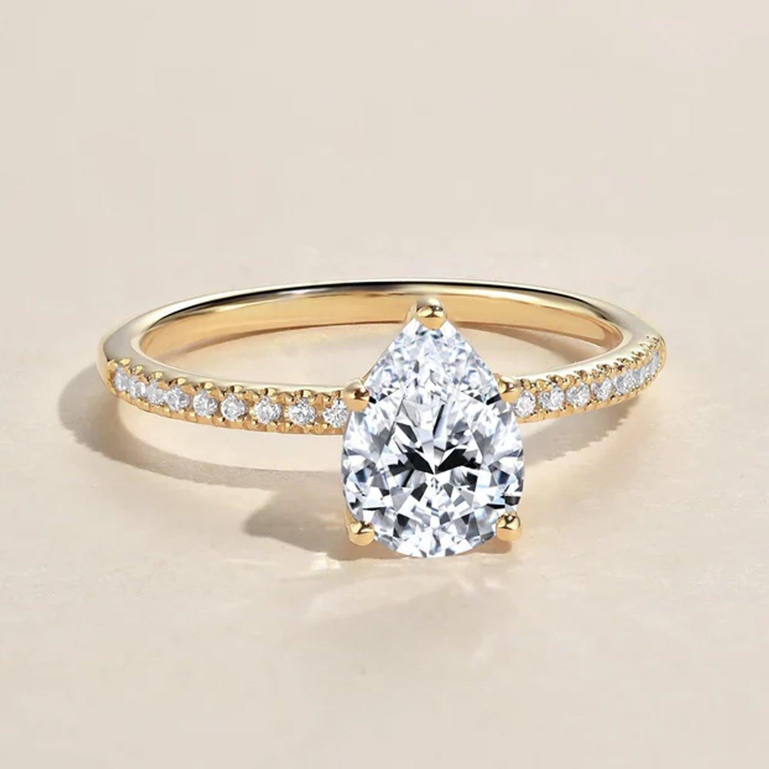 Classic 1.5ct Pear Shaped Moissanite Pave Solitaire Ring.