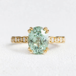 Lydia's Lace | 2CT Oval Green Sapphire Engagement Ring with Lace-Trim Diamond Band.