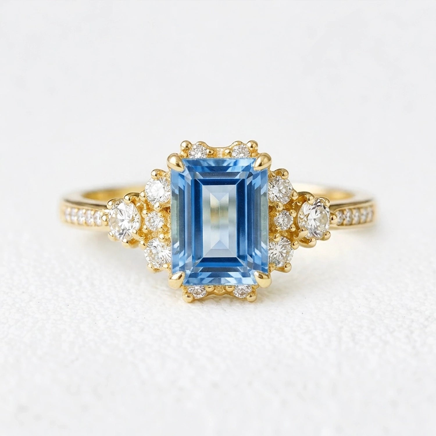 Rosalind‘s Coronet | Emerald Cut Sapphire Halo Engagement Ring