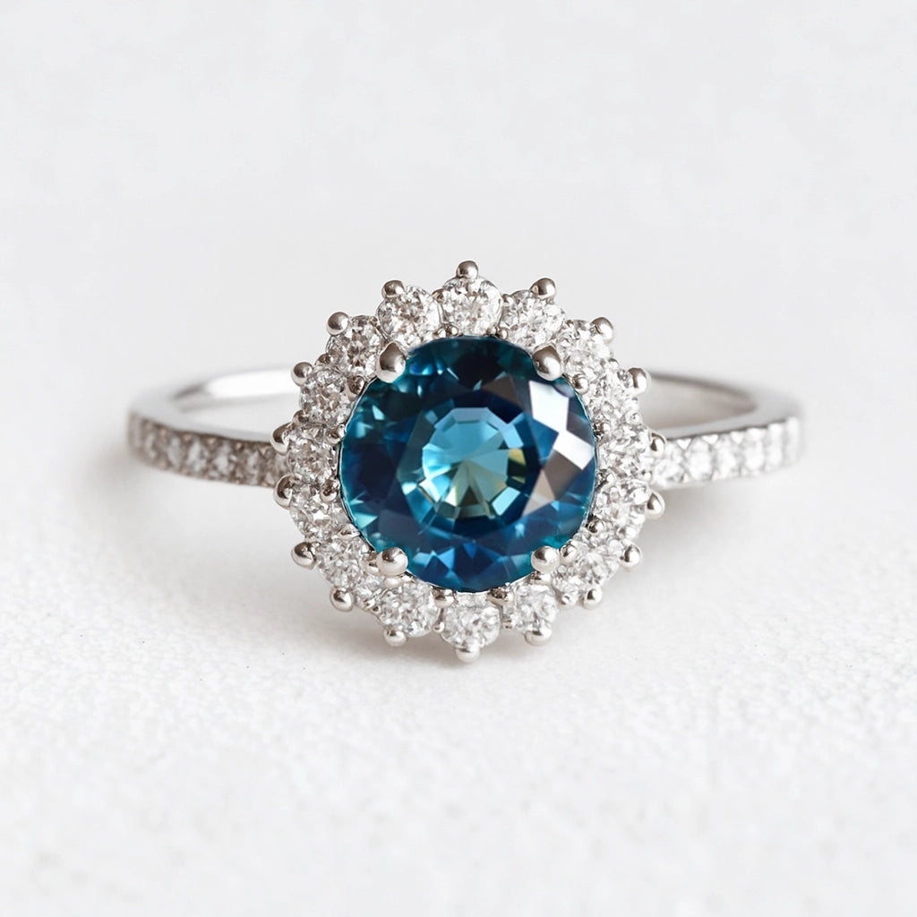 Stella's Spark | Vintage Blue Sapphire Diamond Halo Engagement Ring.