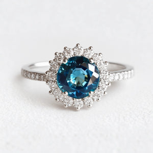 Stella's Spark | Vintage Blue Sapphire Diamond Halo Engagement Ring.
