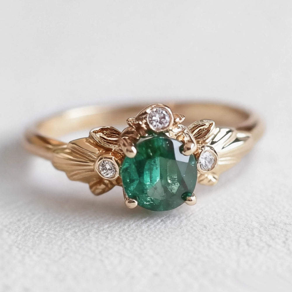 Eve’s Laurel | Natural Emerald Engagement Ring with Diamond Leaf Setting.