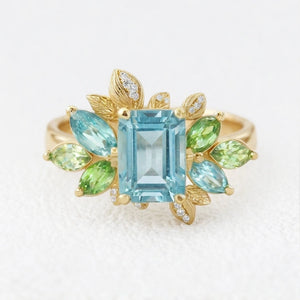 Celeste’s Bloom | Emerald Cut Blue Topaz Leafy Engagement Ring.