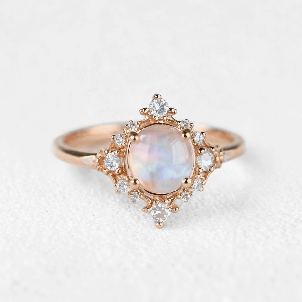 The Eternal Stars Engagement Ring – Cabochon Moonstone & Graduated Diamond Halo.