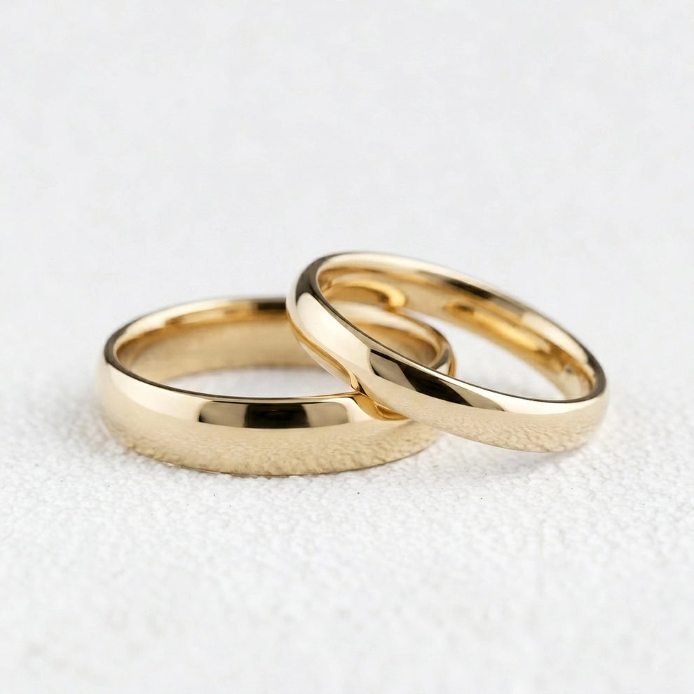The Mirrored Pair – Polished Arc Wedding Bands in Solid Gold.
