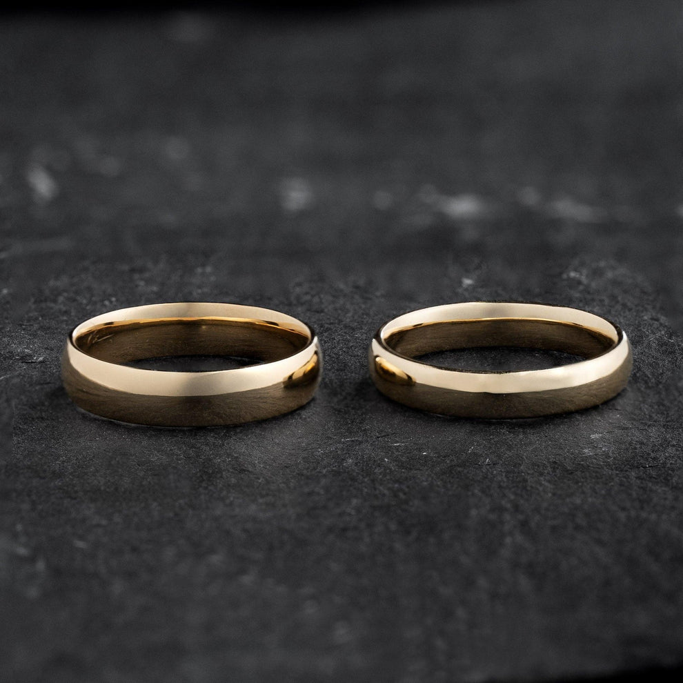 The Mirrored Pair – Polished Arc Wedding Bands in Solid Gold.