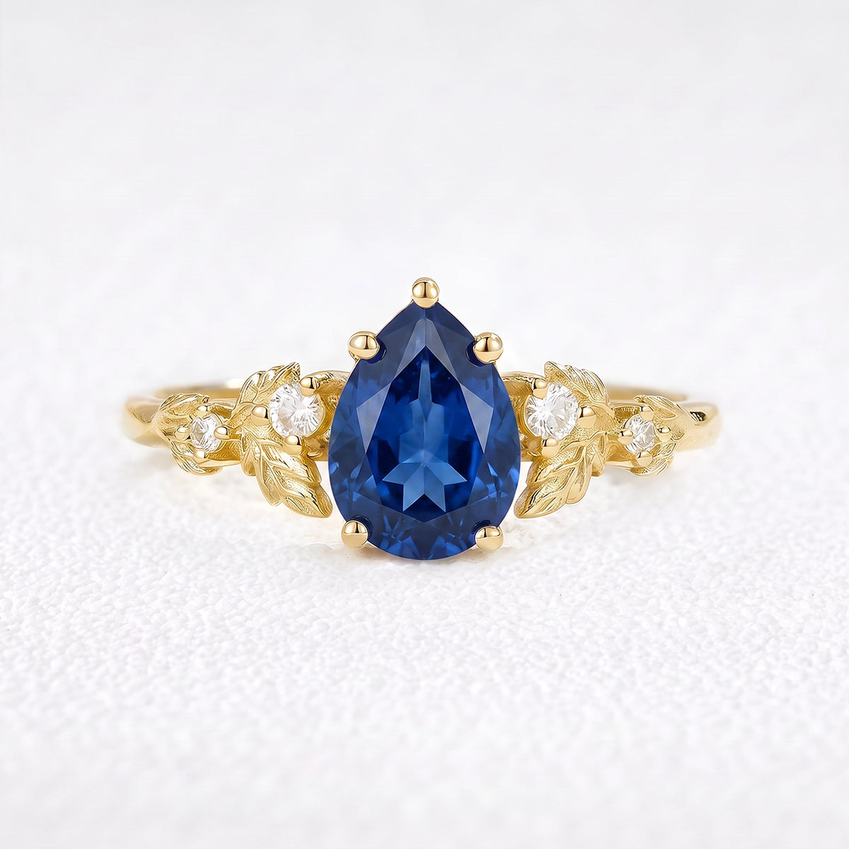 Daisy’s Twilight | 1.5CT Pear Cut Blue Sapphire Engagement Ring