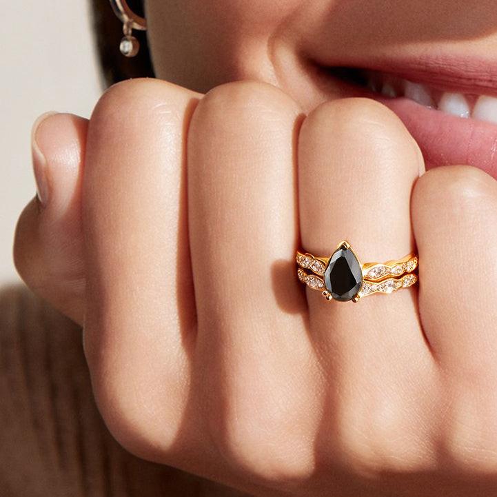 Aria‘s Cipher | Pear Cut Black Diamond Ring & Matching Diamond Band Ring Set.
