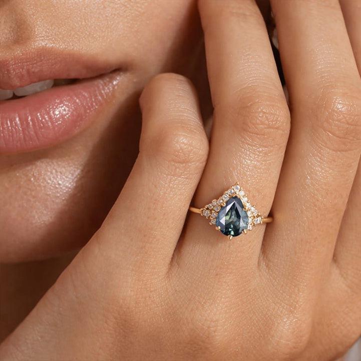 Lyra’s Twilight | Pear Blue Sapphire Partial Halo Ring.