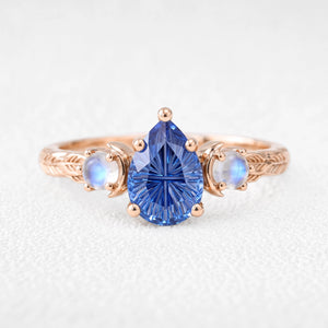 Asteria’s Moonveil | Pear Fantasy-Cut Royal Blue Sapphire & Moonstone Filigree Engagement Ring