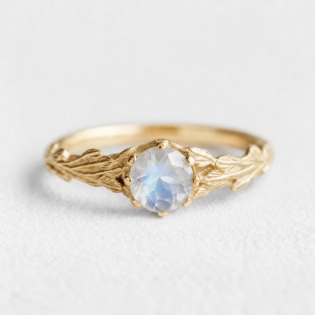 Athena’s Wings | Round Moonstone Olive Branch Engagement Ring.