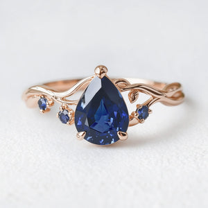 Athena’s Royalty | 1CT Pear Cut Royal Blue Sapphire Engagement Ring.