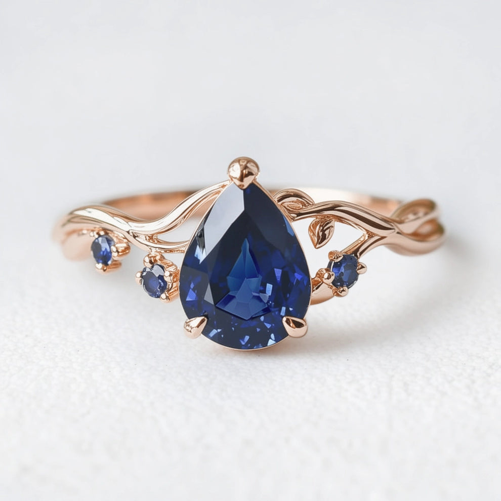Athena’s Royalty | 1CT Pear Cut Royal Blue Sapphire Engagement Ring.