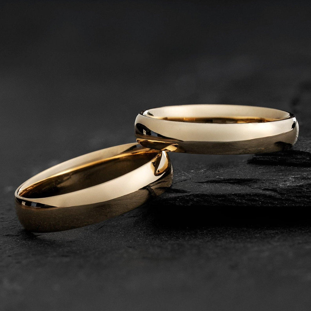 The Mirrored Pair – Polished Arc Wedding Bands in Solid Gold.