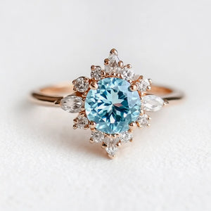 Marina's Swell | Round Cut Aquamarine Halo Engagement Ring.