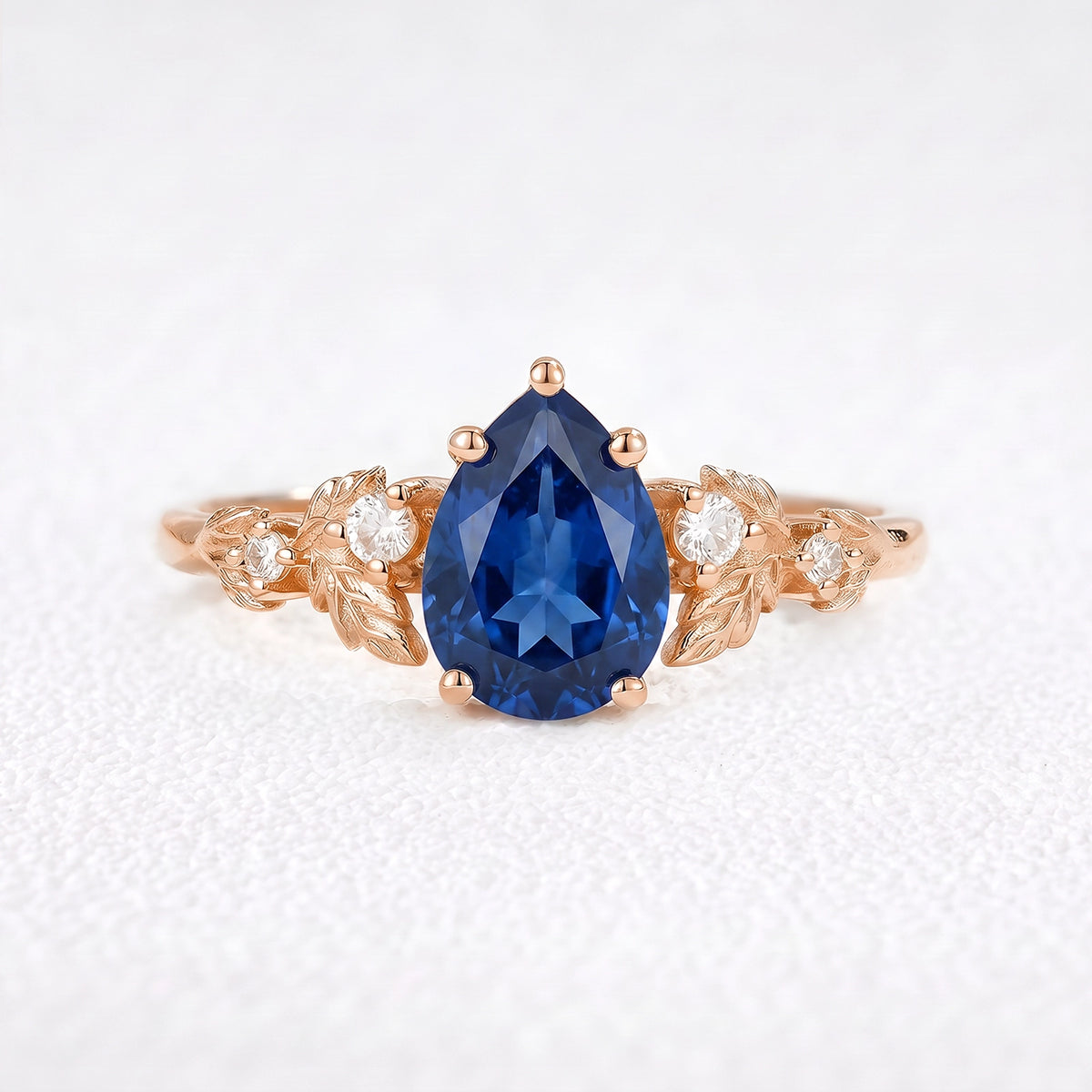 Daisy’s Twilight | 1.5CT Pear Cut Blue Sapphire Engagement Ring