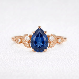 Daisy’s Twilight | 1.5CT Pear Cut Blue Sapphire Engagement Ring