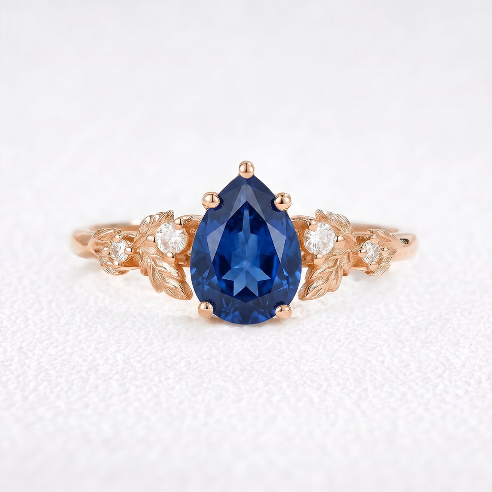 Daisy’s Twilight | 1.5CT Pear Cut Blue Sapphire Engagement Ring