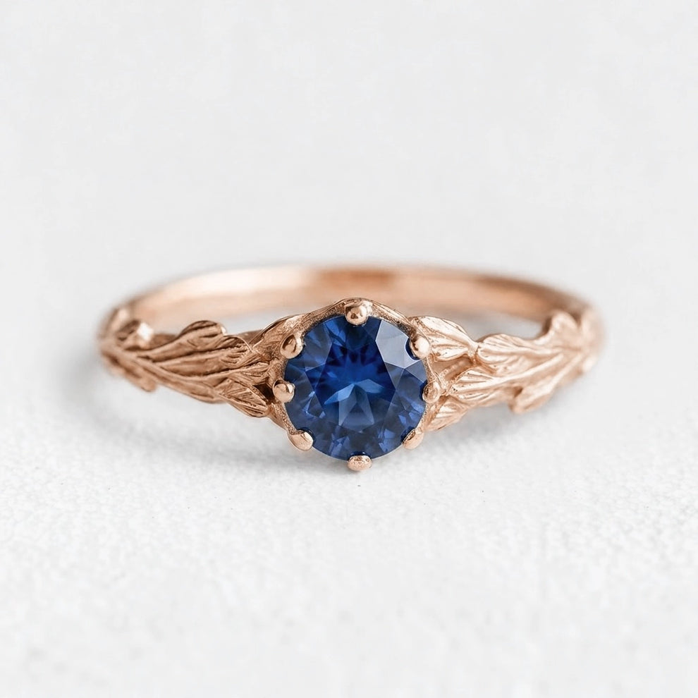 Athena’s Wisdom | Round Blue Sapphire Olive Branch Engagement Ring