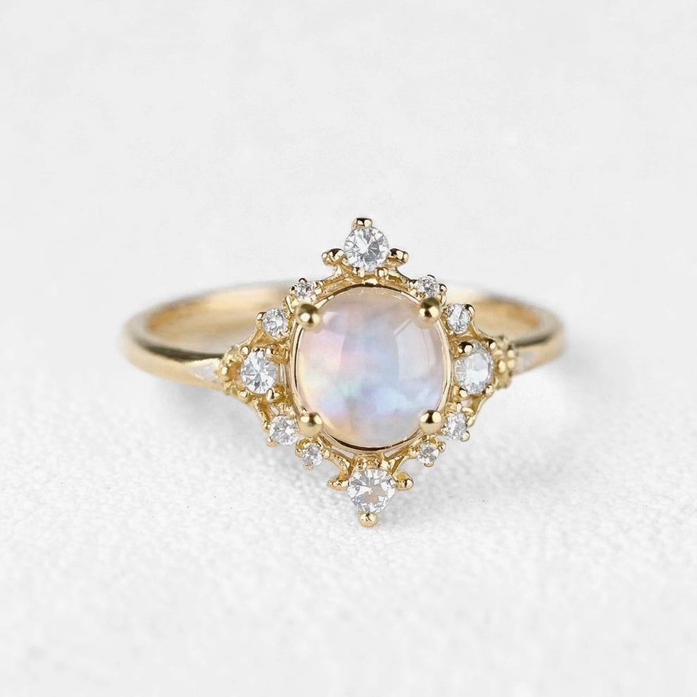 The Eternal Stars Engagement Ring – Cabochon Moonstone & Graduated Diamond Halo.